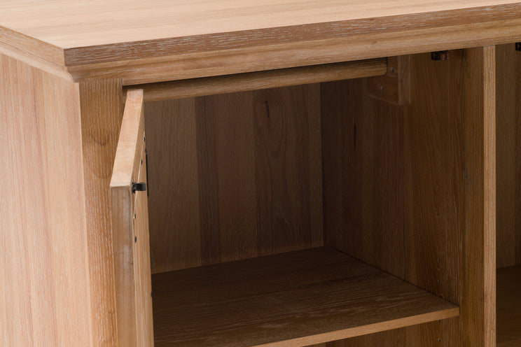 Wooden cabinet with open door revealing empty interior